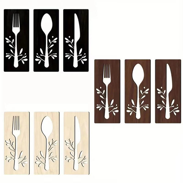 A set of three wooden utensil wall decor pieces featuring forks, spoons, and knives with leaf designs.