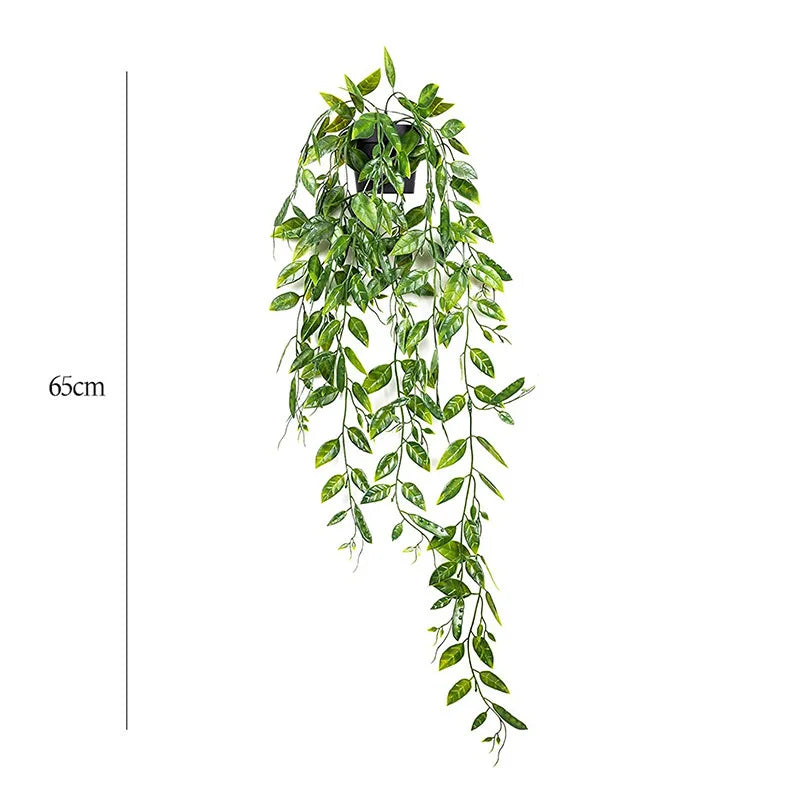 A long, cascading arrangement of artificial green eucalyptus vines hanging from a dark fixture.