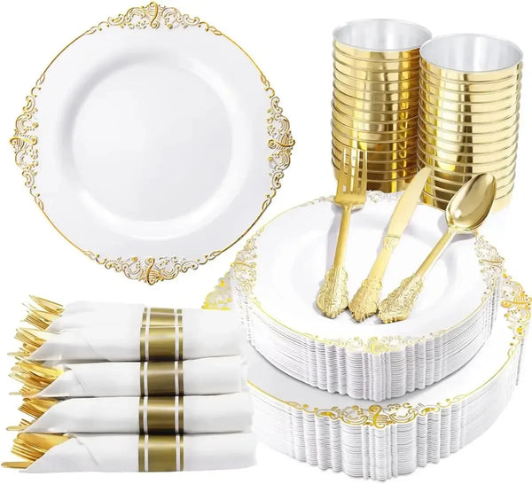 Elegant white and gold disposable dinnerware set including plates and cutlery