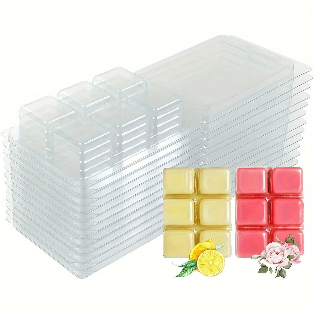 A stack of clear plastic clamshell molds for DIY wax melts, with samples of yellow and pink wax visible.