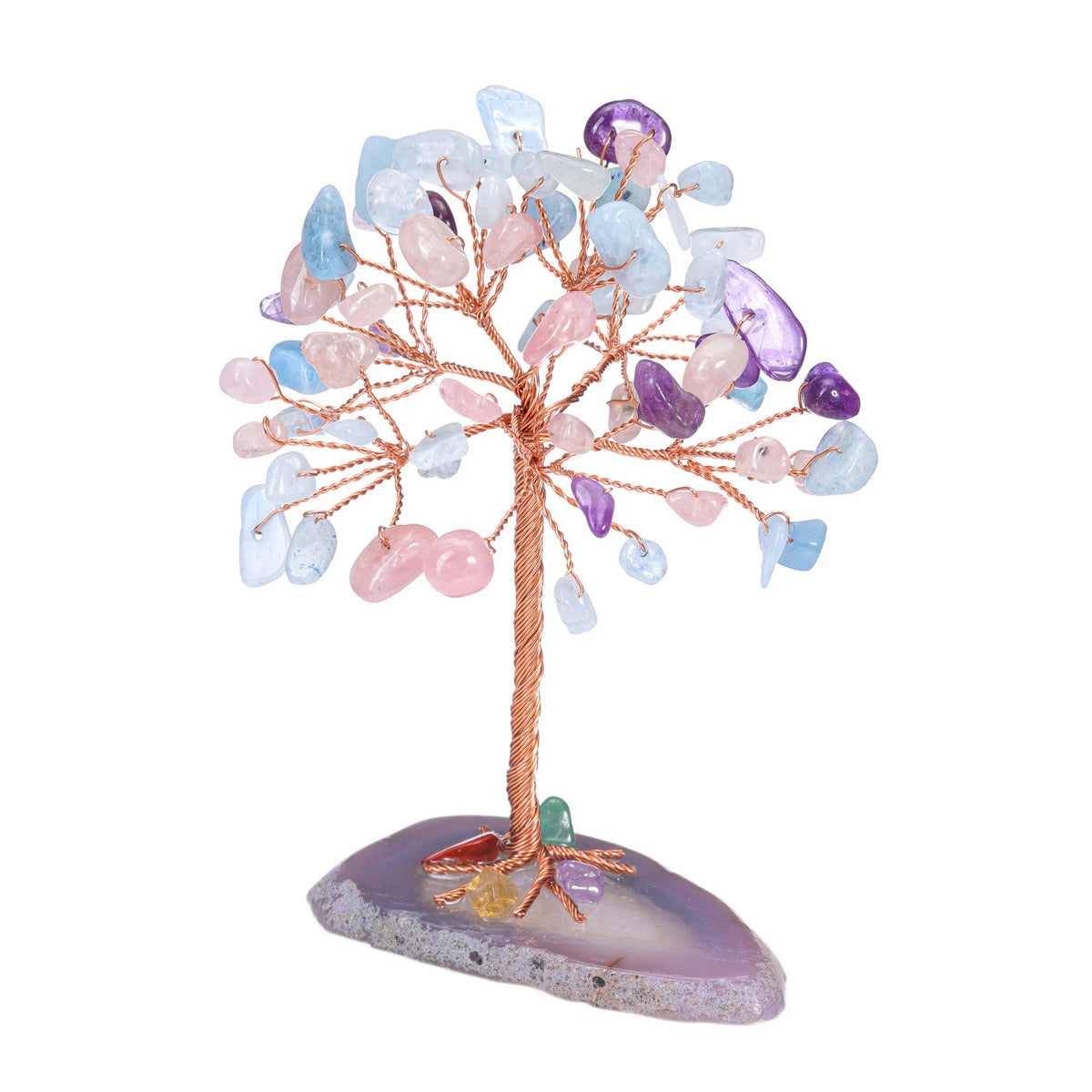 A crystal money tree decor featuring various translucent and colored quartz crystals branching from a pink stand.