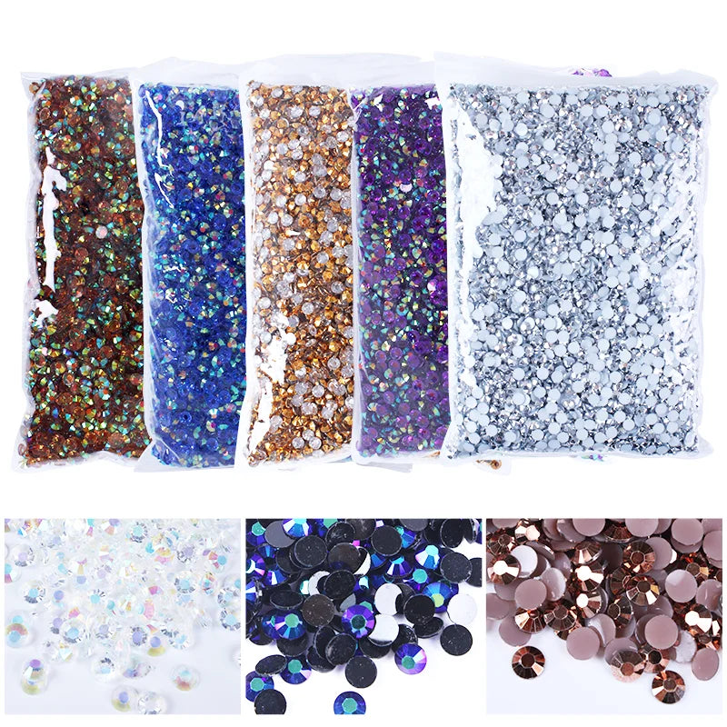 A collection of various colored resin rhinestones and glitter for crafting projects.