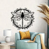 Elegant black dragonfly metal wall art displayed on a light blue sofa.