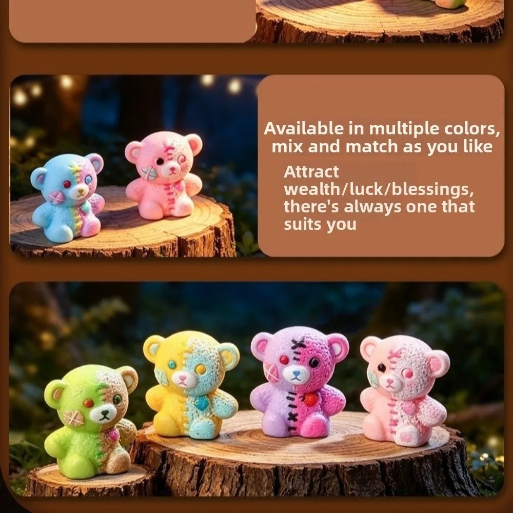 A set of colorful resin bear figurines in various shades and colors displayed on a wooden surface.