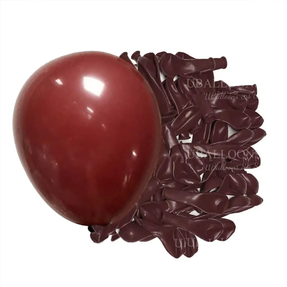 A cluster of deep burgundy latex balloons is shown against a white background.