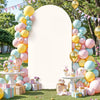 A white arch backdrop decorated with a vertical arrangement of pastel balloons and floral accents for wedding or party decor.