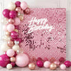 Pink shimmer sequins wall backdrop panels for party decor featuring various pink and gold balloons
