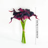 A bouquet of six deep purple artificial calla lilies with green stems shown against a white background.