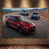 Red Ford Mustang Shelby GT canvas wall art parked on an asphalt road with mountains in the background.