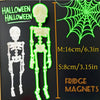 A set of poseable magnetic skull fridge magnets in white and neon green.