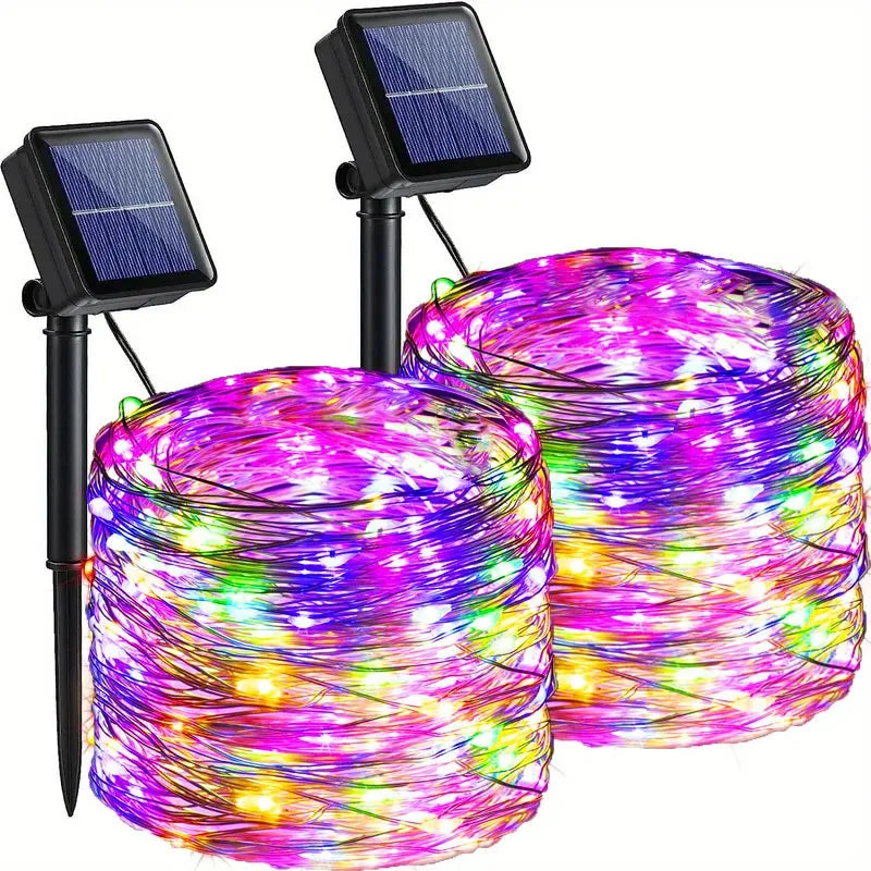 A bundle of colorful LED string lights is displayed next to a solar panel light fixture.