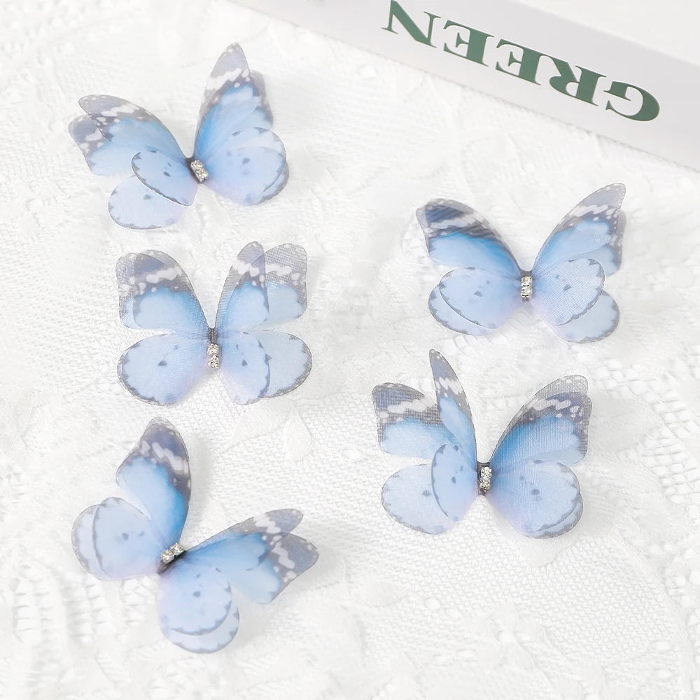 A set of light blue and gray 3D embroidered butterfly patches for crafts and decor