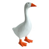 A white resin figurine of a goose with an orange beak and feet.