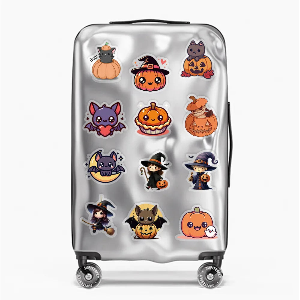 A silver rolling suitcase decorated with various Halloween-themed stickers.