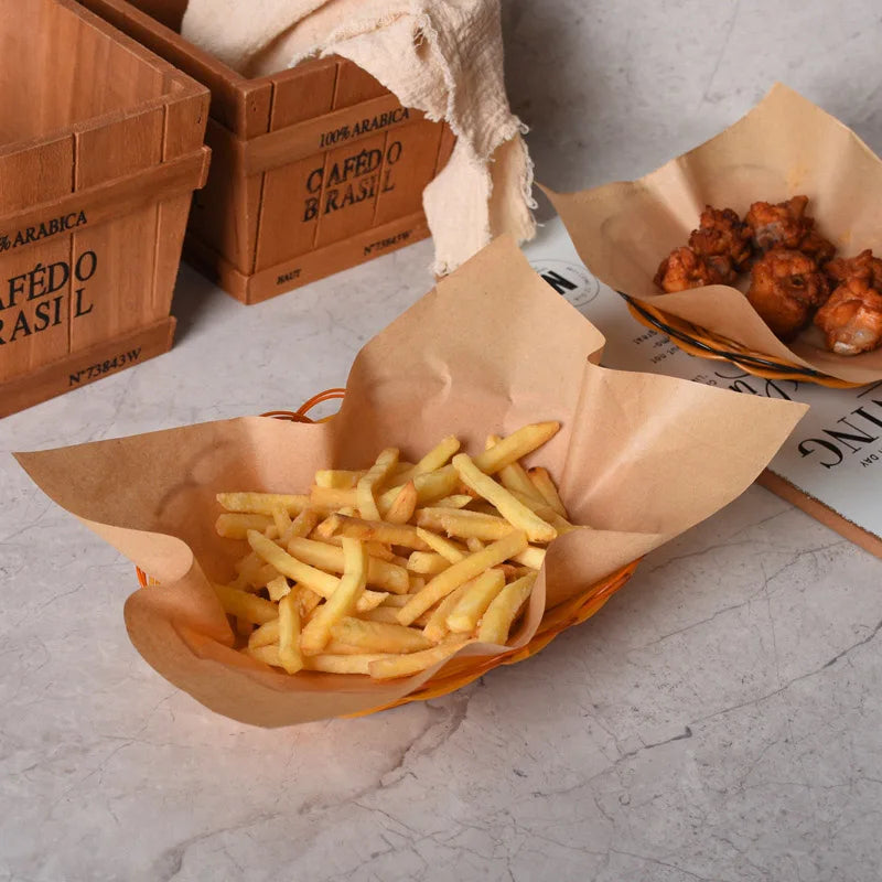 A pile of golden french fries served in a brown paper cone on a light surface.