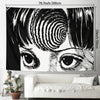 A black and white tapestry wall hanging featuring a stylized, intense eye design inspired by Junji Ito manga.
