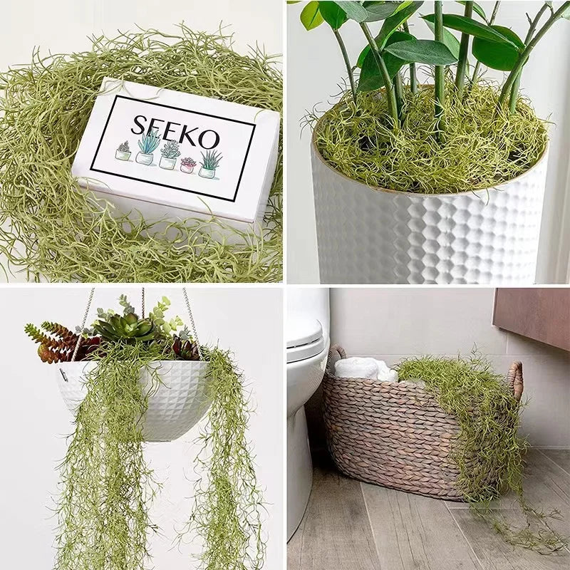 A collection of artificial plant vines and succulents displayed in a white pot and woven moss, with another hanging vine in a