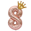 Rose gold foil balloons shaped like the number 8 and a gold crown