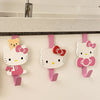 Three pink and white cat-themed cartoon hooks for over-the-door hanging storage