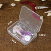 Clear plastic box containing mermaid tail birthday candles decorated with purple and pink glitter and starfish