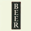 A vertical black metal sign with the word BEER written in white block letters.
