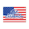 A rectangular tapestry featuring the American flag design with a crown logo and the text SCOTTY CAMERON FINE MILLED PUTTERS.