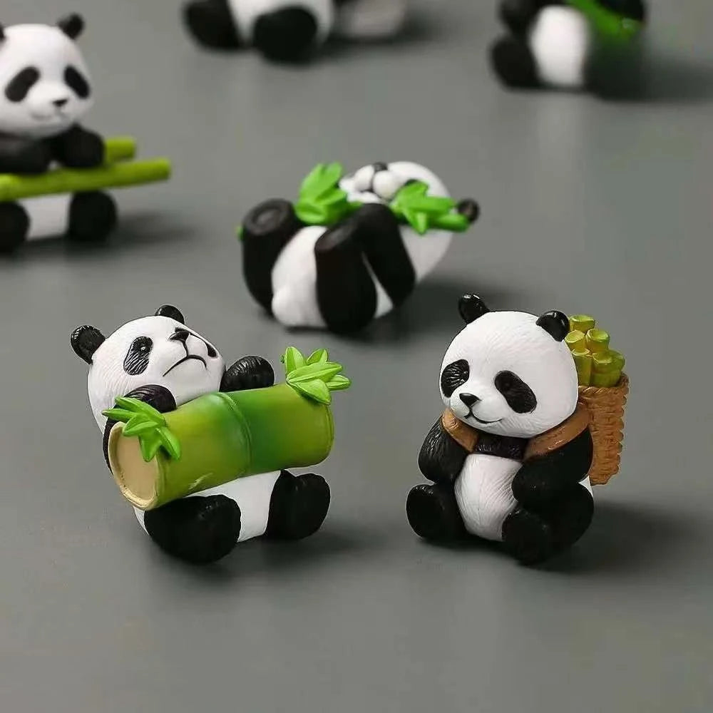 A set of mini resin panda bonsai figurines featuring green bamboo leaves.