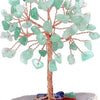 A crystal money tree decor featuring light green, translucent leaves on a wooden branch.