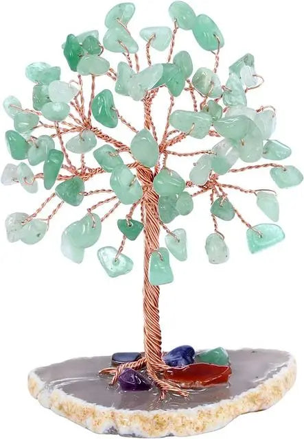 A crystal money tree decor featuring light green, translucent leaves on a wooden branch.