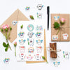 A collection of cartoon tooth fairy stickers featuring various teeth and related items on kraft paper.
