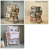 A set of rotating photo frames in bronze and pink floral designs displayed on a stand.