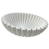A white modern ruffle scalloped decorative bowl with deeply fluted sides.