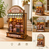 Wooden florist shop display box with a striped awning and various floral arrangements.