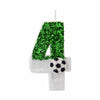 A white candle shaped like the number 4 covered in green glitter, with a soccer ball decoration.