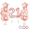 A collection of rose gold foil balloons including a number 2 and a number 1, used for milestone birthday decor.