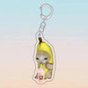 A yellow cat holding a pink ice cream cone charm on an acrylic keychain.
