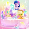 A collection of My Little Pony Magic Bottle collectible figurines featuring a purple pony, a yellow pony, and various sparkli