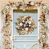An artificial maple leaf vine garland wreath framed in white, featuring dried leaves and white berries for autumn decor.