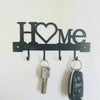 Black letter-shaped metal wall key holder with four hooks shaped like H O M E