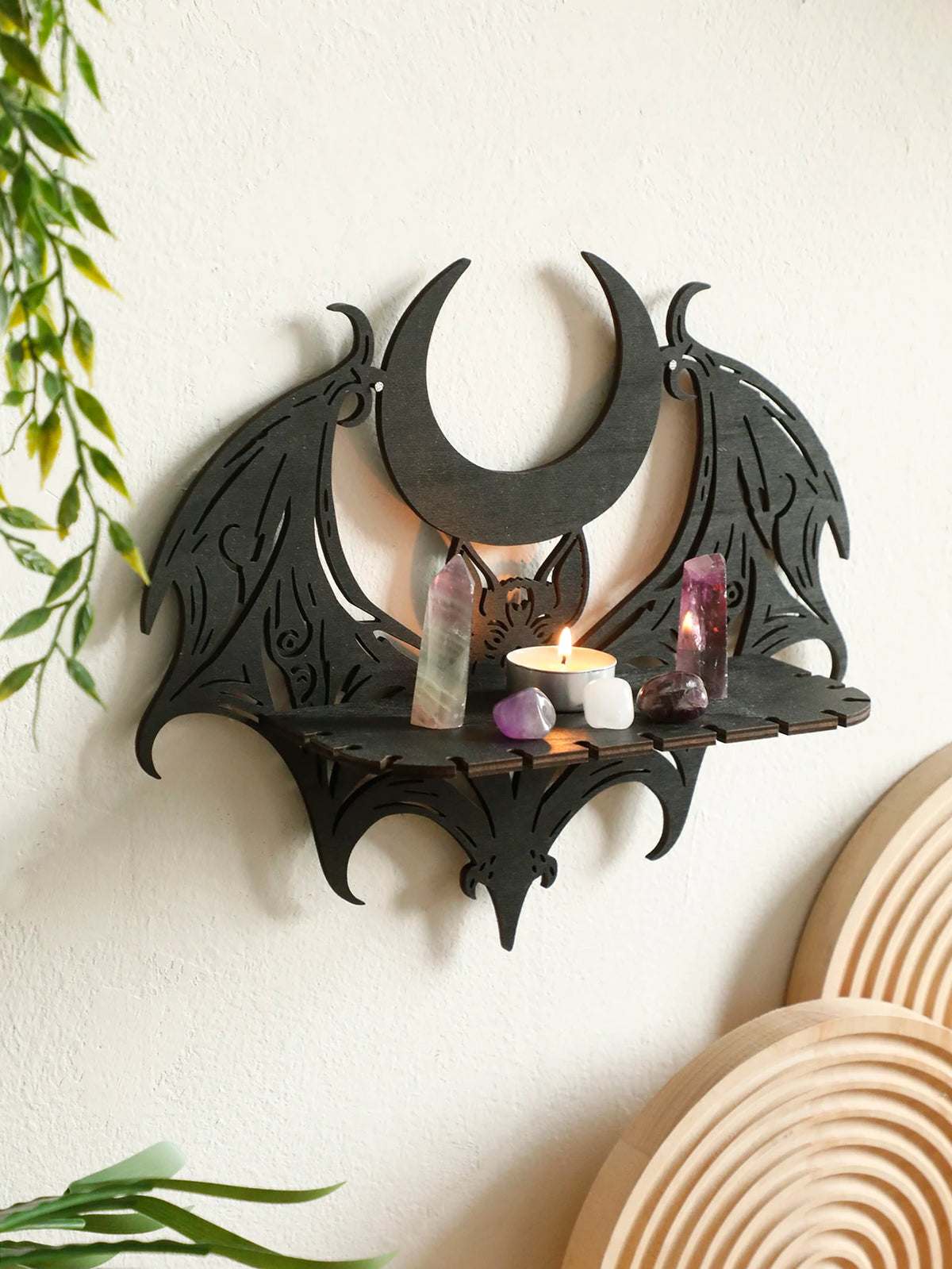 Black gothic bat moon floating wall decor with amethyst crystals and a candle