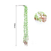 A vertical arrangement of artificial green and reddish-brown plant vines used as a wall hanging.