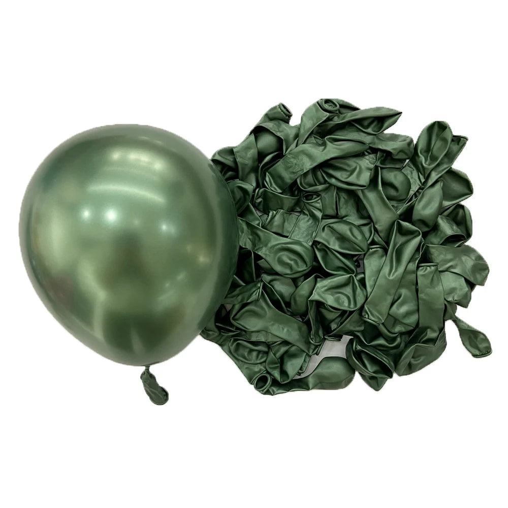 A single metallic sage green latex balloon next to a bunch of dark green crinkled fabric balloons.