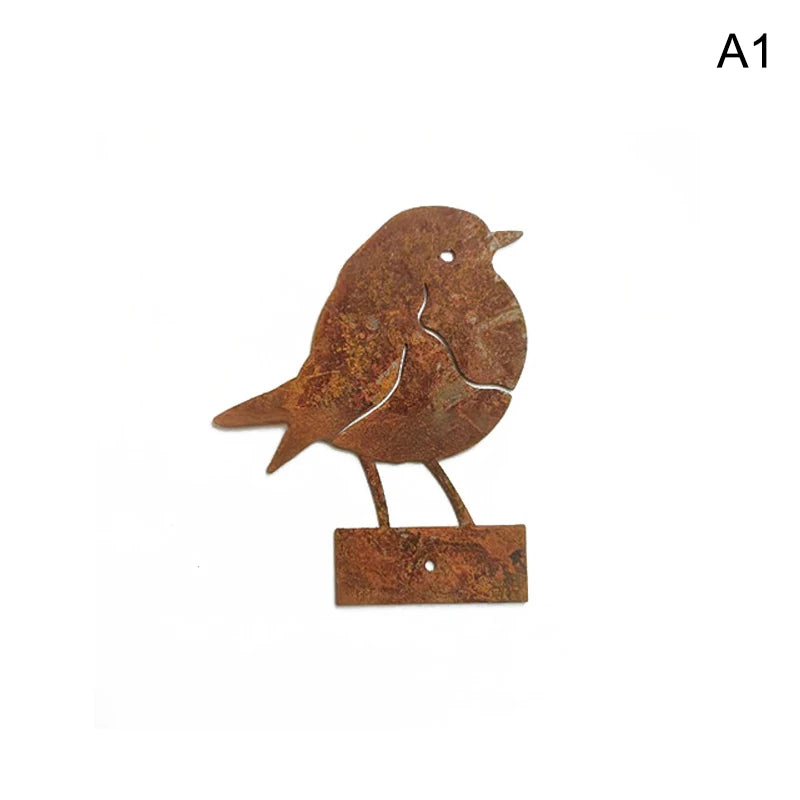 A rustic metal bird sculpture with a brown, weathered finish mounted on a small wooden base.