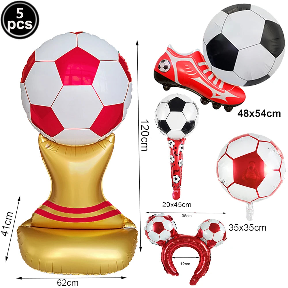 A set of inflatable soccer balls and a gold stand for party decoration.