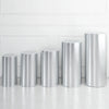 A row of polished silver cylinder stands used as decor for weddings and events.
