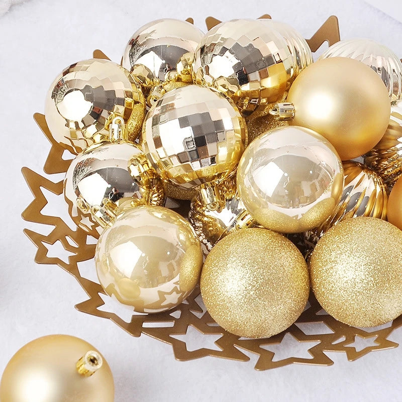 A collection of 24 gold and silver glitter Christmas tree ornament balls arranged on a gold star-shaped tray.