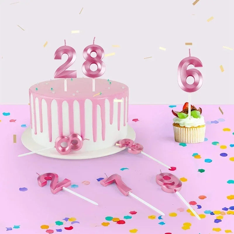 A pink birthday cake decorated with pink dripping frosting and candles, surrounded by pink confetti and decorative candles.