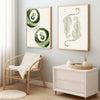 A set of two canvas prints featuring a sage green cheetah and pool ball design, displayed on a light gray wall.