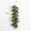 A long, artificial green pine garland hanging vertically against a white background.
