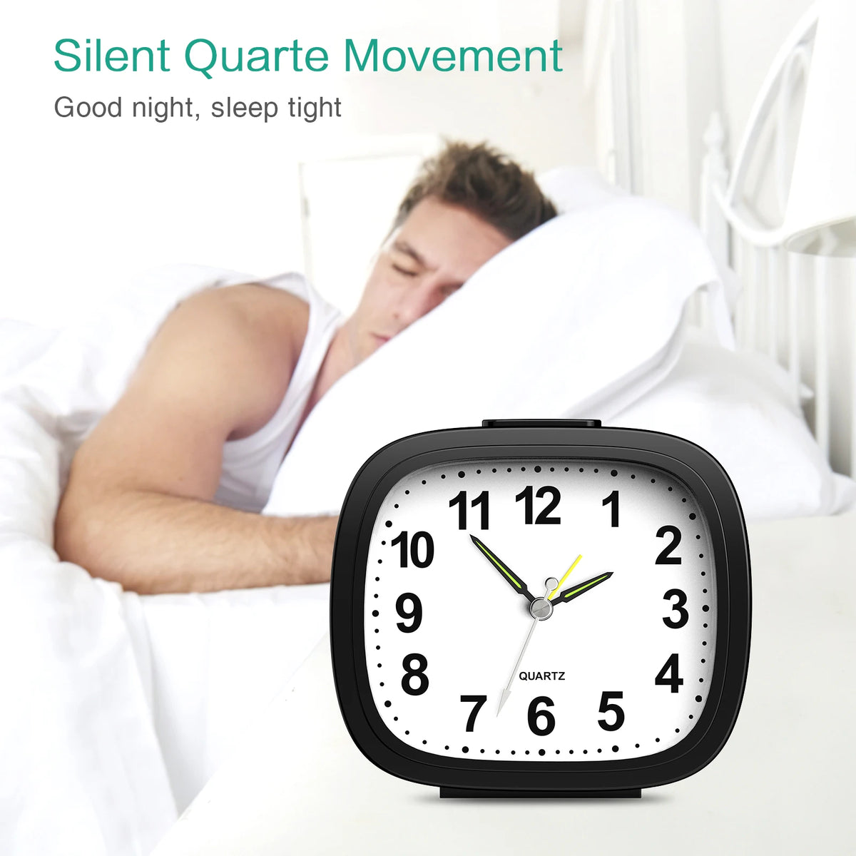 A black quartz analog alarm clock with a luminous display is shown on a bedside table next to a sleeping person.